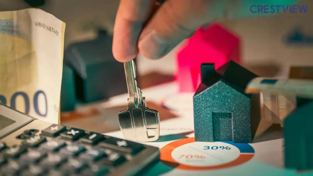 How Long Does A Home Insurance Claim Stay On Your Record? Clue Reports And Premiums 1 hand-holding-house-key-near-calculator-and-model-home