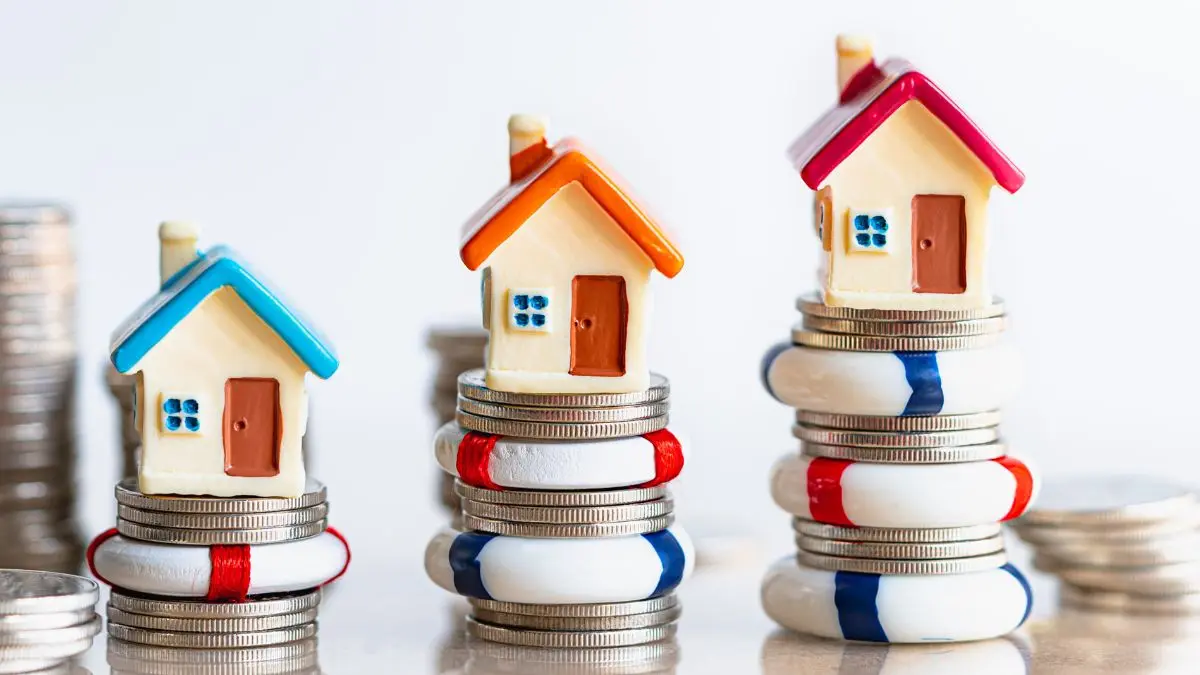 toy-houses-on-coins-with-life-preserver-rings