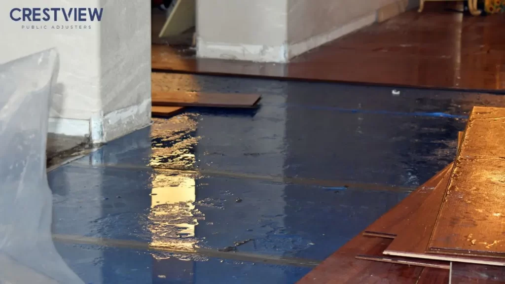 Condo Association Vs. Unit Owner Insurance Claims In Ny And Nj: Who Pays For Water And Storm Damage? 1 water-damaged-floor-with-standing-water-inside-home