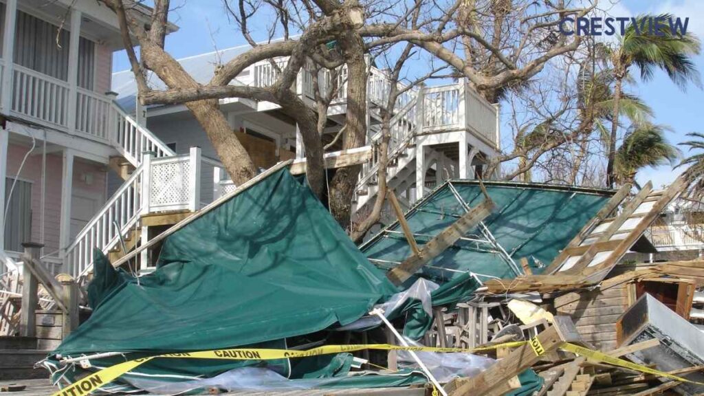 Storm Damage Insurance Claim In Pennsylvania: How To Document Wind, Hail, And Roof Damage This Spring 3 Collapsed structure with caution tape and debris scattered around coastal properties after a storm